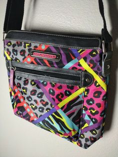 I am selling one Lily Bloom purse Approximate Measurements: Width: 11 3/8" Height: 9.75" Depth: 2 5/8" The zipper pull is missing from the backzipper It comes from a clean, smoke-free home Feel free to contact me if you have any questions! Trendy Multicolor Shoulder Bag With Zipper, Multicolor Shoulder Bag With Zipper For School, Multicolor Zipper Closure Shoulder Bag For School, Multicolor Crossbody Shoulder Bag For School, Retro Multicolor Bags With Zipper Pocket, Fun Multicolor Crossbody Shoulder Bag, Multicolor Crossbody Bag With Zipper Pocket, Retro Multicolor Shoulder Bag With Adjustable Strap, Retro Multicolor Crossbody Bags