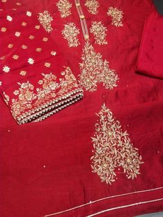 Item Overview Atharva Embroidered Salwar Kameez with Beautiful Neck and all Over Embroidery in Red and Banarsi Silk Dupatta in Red w/ Santoon  Dno-CH1015A Fabric:  * Shirt Chanderi - Yellow 2.5 Mts, with Neck and alll over embroidery Design  * Dupatta: Banarsi Silk Dupatta 2.5 Mtrs. Motifs mau wary * Bottom Santoon Silk 2.5 Mts. Excusive Hand Embroidered Party Wear Punjabi Suit. Customization: * Fabrics: Designs Can be made in different Fabrics. * Stitching Available Care:  * Dry Clean/ Avoid di Festival Raw Silk Sets With Intricate Embroidery, Semi-stitched Embroidered Sets In Chinon, Semi-stitched Nida Sets With Dabka Work, Diwali Lawn Suit With Zari Work In Raw Silk, Festival Raw Silk Sets With Dabka Work, Bollywood Red Lawn Suit For Wedding, Embroidered Gold Raw Silk Lawn Suit, Gold Embroidered Raw Silk Lawn Suit, Traditional Raw Silk Lawn Suit With Dabka Work