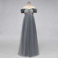 This elegant Gray Regency Bridgerton Empire Waist Lace Formal Dress is a must-have staple for your formal wardrobe. Crafted from a luxurious lace and tulle fabric, this dress has a classic 1920s Empire style silhouette that is perfect for your next Bridgerton ball, regency-themed event or grand wedding. With timeless style and endless elegance, you'll look like a true Bridgerton! Silhouette: Empire Style: Elegant Primary Fabric: Lace and Tulle Neckline: Off the Shoulder Closure: Corset Back Made Tulle Gown With Sweep Train For Banquet, Banquet Evening Dress With Fitted Bodice, Banquet Evening Dress With Fitted Bodice And Tulle, Tulle Evening Dress With Fitted Bodice For Banquet, Lace Evening Dress With Sweep Train For Prom, Elegant Banquet Ball Gown With Tulle Skirt, Banquet Gown With Organza Tulle Skirt, Sheer Bodice Tulle Dress For Banquet, Floor-length Tulle Gown For Banquet