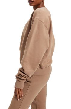 Extra-long sleeves and a drapey oversized fit elevates the lofty vibe of a cotton pullover that's lined with soft and snuggly fleece. 26" length (size 2) Crewneck Long sleeves Ribbed cuffs and hem 100% cotton Machine wash, tumble dry Imported Women's Clothing Black Owned and Founded Beige Sweatshirt With Ribbed Cuffs For Loungewear, Oversized Beige Hoodie With Crew Neck, Beige Ribbed Cuffs Sweatshirt For Loungewear, Beige Long Sleeve Hoodie For Loungewear, Beige Long Sleeve Athleisure Sweatshirt, Beige Long Sleeve Sweatshirt With Ribbed Cuffs, Cozy Beige Sweatshirt With Ribbed Cuffs, Comfortable Beige Long Sleeve Sweatshirt, Cozy Sweats With Soft Texture For Fall