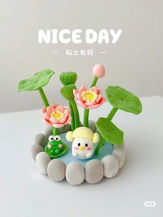 an image of a nice day with flowers and frog