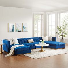 a living room with blue couches and white rugs