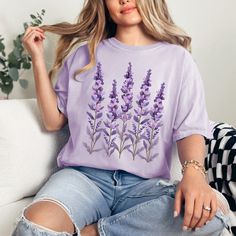 Embrace the serene beauty of nature with our 'Lavender' comfort colors t-shirt. Adorned with a graceful lavender design, this tee captures the essence of endless lavender fields under the summer sky. Crafted from lightweight, breathable fabric, it's the perfect blend of comfort and style for any casual occasion. Ideal for those who find solace in the soothing scent and sight of lavender, this shirt brings a piece of the tranquil outdoors to your everyday wardrobe. Whether you're strolling throug Summer Lavender Tops With Graphic Print, Lavender Graphic Print Tops For Summer, Lavender Tops With Graphic Print For Summer, Lavender Relaxed Fit Casual Top, Casual Lavender Top With Graphic Print, Lavender Graphic Cotton Tee, Lavender Cotton Graphic Tee, Lavender Graphic Tee In Cotton, Lavender Cotton Summer Shirt