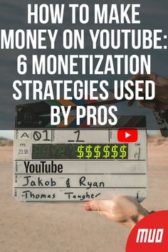 a person holding up a sign with the words how to make money on youtube 6 moneti