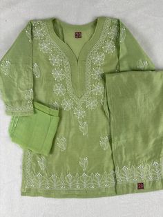 Introduce your child to the timeless elegance of traditional Indian wear with our Lucknowi Kurta with Pajama set, accompanied by a plain dupatta. Designed for kids in size 2-3 years, this ensemble features intricate craftsmanship and a sophisticated Kheera Green color, perfect for any special occasion. Key Features: Color: Kheera Green, offering a refined and versatile look. Kurta Design: The kurta boasts intricate work on the front with leaf boota, border, sleeves, and back, showcasing the exquisite craftsmanship of Lucknowi embroidery. Pajama: Paired with a comfortable and stylish pajama that complements the kurta perfectly. Dupatta: Includes a plain dupatta that adds a touch of traditional elegance, completing the ensemble. Size: Available in size 2-3 Years for kids, ensuring a perfect Bollywood Green Palazzo Set With Embroidered Border, Green Bollywood Palazzo Set With Embroidered Border, Green Embroidered Palazzo Set For Navratri, Green Palazzo Set With Embroidered Border For Navratri, Traditional Palazzo Set For Eid Ceremonies, Festive Straight Kurta Sets With Embroidered Border, Green Straight Kurta Set With Embroidered Border, Fitted Sharara With Embroidered Border For Eid, Green Embroidered Sets For Diwali