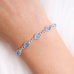 "Aquamarine Bracelet, 925 Sterling Silver Bracelet, Handmade Bracelet, March Birthstone Bracelet, Bohemian Jewelry, Birthday Gift For Her Gemstone Name - Aquamarine  Stone Quality - AAA Weight - 4.94 gm Stone Length - 0.6 cm  Stone Width - 0.4 cm Length - 6 inch to 9 inch sizes are available, we give 0.5 inch adjustable in the size which you order ( NOTE - 0.5 INCH ADJUSTABLE IS INCLUDED IN YOUR ORDERED SIZE ) Stone Shape - As shown in the picture You'll get the exact product as shown in the pic Silver Dainty Gemstone Bracelets, Silver Dainty Gemstone Bracelet, Dainty Silver Bracelet With Gemstone, Dainty Silver Gemstone Bracelet, Silver Gemstone Chain Bracelet Gift, Silver Chain Bracelet With Natural Stones As Gift, Sterling Silver Bracelet With Natural Stones As Gift, Aquamarine Bracelet, Birthstone Bracelet