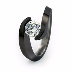 Luxury Black Titanium Rings, Elegant Silver Titanium Ring, Elegant Stainless Steel Promise Rings, Elegant Stainless Steel Diamond Promise Ring, Black Titanium Anniversary Rings, Classic Titanium Jewelry For Formal Occasions, Minimalist Titanium Jewelry For Formal Occasions, Classic Formal Titanium Jewelry, Classic Black Ring With Single Diamond