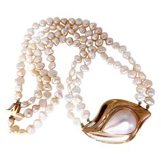 21 x 14mm Pear Shaped Mabe Pearl necklace. Double stranded 6.5mm fresh water beads. Center Pendant: 47 x 27mm With 14kt. yellow gold clasp Necklace: 16 inches long. clasp: 7x 3mm clasp Saltwater Pearl Necklace, Mabe Pearl Necklace, Tahitian Pearl Necklace, Pearl Chain Necklace, Mabe Pearl, Water Beads, Aquamarine Beads, Clasp Necklace, Gold Pearl Necklace