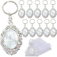 an assortment of key chains and charms with a christmas ornament in the center