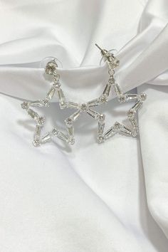 These earrings are sure to make a statement! These Baguette star earrings are so chic they will elevate any look! Elegant Star-shaped Crystal Earrings For Party, Silver Starburst Earrings For Party, Silver Star Embellished Earrings For Party, Elegant Star Charm Earrings For Party, Elegant Party Earrings With Star Charm, Silver Star Charm Earrings For Party, Party Drop Earrings With Star Charm, Silver Star-shaped Crystal Earrings For Party, Elegant Starburst Earrings For Party