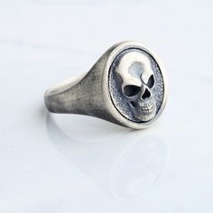 Silver skull handmade men ring. Inspired by the gothic style, handcrafted flawlessly You can buy this ring, which will attract all the attention thanks to its flawless handwork details, either 925 sterling silver or silver plated on white bronze.both materials are produced with the same craftsmanship and have the same appearance.This unique ring, which those who see it will look at again and cannot take their eyes off, will be packaged appropriately for gifting. MATERIALS: - Solid 925 sterling silver - White Bronze ( silver plated )  SHIPPING: - We use International P Shipping Service - 3-10 Business Days PACKAGING: -all your orders will be shipped with good packaging suitable for gifting Biker Skeleton, Vampire Skull, Dark Girl, Punk Men, Gothic Men, Handmade Skulls, Gothic Gifts, Skeleton Skull, Biker Rings