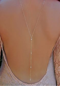 Cubic Zirconia Lariat Y Back Necklace This very elegant Lariat Back Necklace is perfect for that special occasion. This has a delicate a round CZ in the front. Gorgeous! Materials: ✦ Sterling Silver or Gold Filled Chain ✦ Shown at 26 with an 8 drop (No Clasp) ✦ 2 - Silver or Gold  Measure with dress on to ensure low back is correct size Luxury Yellow Gold Backdrop Necklace For Women, Luxury Yellow Gold Backdrop Necklace As A Gift, Silver Crystal Lariat Necklace For Wedding, Wedding Lariat Necklace, Elegant Cubic Zirconia Lariat Necklace For Wedding, Gold Crystal Drop Necklace For Wedding, Silver Cubic Zirconia Lariat Necklace For Wedding, Dainty Cubic Zirconia Backdrop Necklace For Wedding, Dainty Drop Backdrop Necklace For Wedding