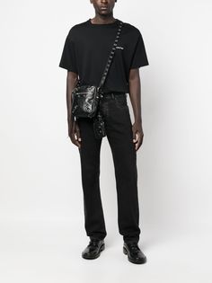 Le Cagole messenger bag from BALENCIAGA featuring black, calf leather, adjustable shoulder strap, gunmetal-tone hardware, eyelet embellishment, stud detailing, front zip-fastening pocket, top zip fastening, removable AirPods Pro holder and removable zipped pouch. Conscious: We've partnered with Good On You – an ethical agency that rates how sustainably brands perform. This item comes from a brand that performs well in relation to their impact on the planet..Width 5,91 in / 15 cmHeight 7,87 in / Leather Shoulder Bag For Streetwear With Zipper, Leather Crossbody Bag For Streetwear, Leather Crossbody Shoulder Bag With Rivets, Edgy Leather Shoulder Bag With Rivets, Designer Everyday Bags With Rivets, Black Designer Bag With Rivets, Cristobal Balenciaga, Balenciaga Men, Balenciaga Logo