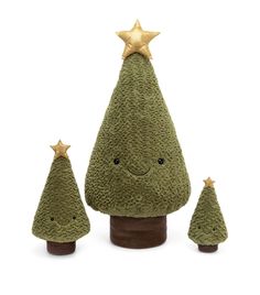 three small green christmas trees sitting next to each other