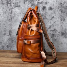 Discover the ultimate men's travel companion in our genuine leather backpack. A stylish rucksack that's a perfect gift for him. Free shipping on all our leather bags. It takes approx seven business days to complete each leather bag. Features: 1. High-quality leather material for durability and style. 2. Spacious main compartment for all your essentials. 3. Additional front and side pockets for easy access to smaller items. 4. Stylish vintage design for a unique and timeless look. 5. Interior: Ce Classic Leather Backpack With Large Capacity, Luxury Brown Backpack For Outdoor, Leather Backpack For Travel, Large Capacity Leather Business Backpack, Luxury Business Backpack With Large Capacity, Classic Brown Leather Backpack For Trip, Large Capacity Leather Backpack In Brown, Luxury Brown Leather Backpack For Trips, Luxury Brown Leather Backpack For Travel