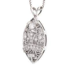 This beautiful pendant is a striking combination of filigree and diamonds, and though it's relatively large (30mm x 13mm), the filigree and the cutouts help create a delicateness. At the top of the pendant is a 3.2mm diamond set into the middle of a white gold star. Ideally suited to hang from a white gold chain (not included), this pendant is a real conversation starter! The design is attributed to the Amaranth Matron, which is the highest rank in the Order of the Eastern Star, an organization Diamond Pendant Necklace With Intricate Design, Luxury Diamond Filigree Necklace, Luxury Diamond Filigree Necklaces, Diamond Filigree Necklace In Fine Jewelry Style, Diamond Filigree Pendant Jewelry, Filigree Diamond Pendant Jewelry, Elegant Filigree Diamond Pendant Necklace, Fine Jewelry Diamond Filigree Necklace, Exquisite Diamond Filigree Necklace