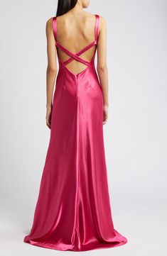 Elevate your next event look in this gorgeous satin gown designed with a sleek V-neckline, cross-back straps and a draped, body-defining silhouette. 59" length; 9" train (size Medium) Hidden back-zip closure V-neck Sleeveless Partially lined 97% polyester, 3% spandex Hand wash, line dry Imported Coastal Formal Dress, Eclectic Formal Dresses, Raspberry Pink Dress, Prom Dress With Cutouts, Orange And Pink Bridesmaid Dresses, Bright Pink Prom Dresses, Long Formal Dresses Elegant, Silk Prom Dresses, Corset Back Prom Dress