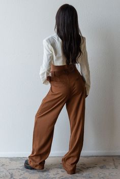 Meet your new fav pant for any season! Timeless and trendy are the Giselle Trouser featuring a loose fit with front pleat detail, side pockets and high waist. Color: Brown Loose Fit Front Pleats Pockets Wide Leg Mid Rise 100% Tencel Model is 5'7", size 25 in bottoms and is wearing size small Chic Tapered Leg Cargo Pants For Work, Chic Fall Wide-leg Cargo Pants, Chic Wide-leg Cargo Pants For Fall, Chic High-waisted Cargo Pants For Day Out, Chic Straight Cargo Pants With Belt Loops, Wide Leg Pants With Belt Loops For Day Out, Chic Brown Bottoms With Side Pockets, Chic Loose-fit Cargo Pants For Fall, Chic Brown Wide Leg Pants With Belt Loops