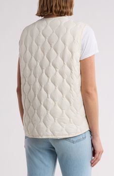 Layer on this quilted taffeta vest featuring roomy patch pockets for enhanced utility. Front button closure Crewneck Front patch pockets Lined, with 100% nylon fill 100% nylon Machine wash, line dry Imported Classic Slippers, Concert Looks, Flip Flop Slippers, Clutch Pouch, Ugg Classic, Quilted Vest, Denim Branding, Sweaters And Leggings