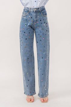 Rhinestone denim pants Stretch denim Straight leg fit Multicolor hotfix rhinestone embellishment. Front zip and button closure Classic 5-pocket construction Styled with Model is 5 ft 6 in, wearing a Small. Bust: 32 in Waist: 24 in Hips: 35 Eras Tour Jumpsuit, Concert Outfit Comfortable, Decorated Jeans School Spirit, Warm Eras Tour Outfits, Classic Denim Jeans, Sparkly Jeans Outfit, Eras Tour Outfits Pants, Rhinestone Pants Outfit, Eras Tour Pants