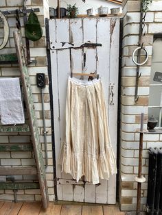 Antique vintage handmade long cream cotton linen skirt with pleated tiered hem size M. Cotton/Linen blend. White waistband with metal clasp at back and open tab, long skirt with pleated tiered section at hem.  Size:  Waist: 28 inches; Length: 40 inches. Weight: 928g (allow 2 kg once packed). Good condition - slight smudge on waistband but otherwise fine. For a larger selection of similar items, visit my website - www.AntheasAttic.co.uk (link on About page). Please contact me if you would like to Cord Trousers, Cotton Apron, Linen Skirt, Grey Cotton, Long Skirt, Cotton Linen, Linen Blend, Beautiful Paintings, French Antiques