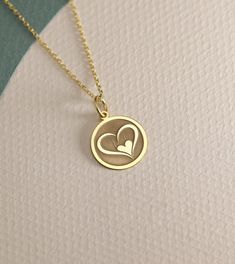 14K Real Solid Gold heart gold necklace ● Material of pendant: Solid Gold 14k ( REAL GOLD ) ● Metal Stamp: 14L ( REAL GOLD ) ● The pendant is available in 6 sizes: - 14,0 mm / 0,55 inches ( Diameter ) In the photos - 15,3 mm / 0.60 inches ( Diameter ) - 16,5 mm / 0,65 inches ( Diameter ) - 19,1 mm / 0,75 inches ( Diameter ) - 21 mm / 0,82 inches ( Diameter ) - 23 mm / 0.90 inches ( Diameter ) ( In the photos the size is 14mm / 0.55 inches Diameter ) ( Jump Ring inner diameter: 4 mm ) ● Material Yellow Gold Minimalist Heart Necklace, 14k Gold Heart Necklace Tarnish Resistant For Gift, 14k Gold Tarnish-resistant Heart Necklace Gift, 14k Gold Open Heart Necklace For Gift, Tarnish Resistant Necklaces For Mother's Day Anniversary Gift, Dainty Round Heart Necklace Tarnish Resistant, Everyday Round Heart Necklace For Mother's Day, Everyday Heart Necklace For Mother's Day, Yellow Gold Necklace For Anniversary On Mother's Day