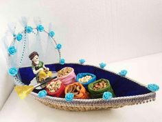 a basket filled with lots of different types of food on top of a white table