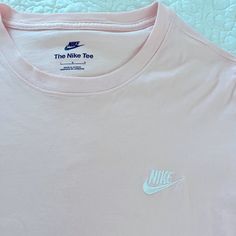 Never Worn. Baby Pink Color. Clean Condition Nike Short Sleeve T-shirt With Branding, Nike Cotton Top, Nike Cotton Tops With Branding, Basic Nike Cotton Tops, Nike Cotton T-shirt For Everyday, Nike Everyday Short Sleeve T-shirt, Nike Basic Tops With Letter Print, Nike Basic Short Sleeve T-shirt, Everyday Nike Cotton Tops