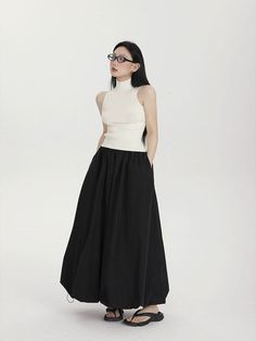 Make a fashion-forward statement with the High-Waisted Balloon Maxi Skirt with Pockets, a contemporary twist on classic femininity. Crafted for effortless charm, this skirt's high waist design cinches to define your silhouette, while the balloon-inspired maxi length billows with a carefree aesthetic. The crisp solid color palette and subtle sheen of the 100% polyester fabric complement the skirt's street-savvy style, while the convenience of pockets adds a practical touch. Dress it down with a t Bubble Maxi Skirt, Parachute Maxi Skirt, Balloon Skirt Outfit 2024, Long Skirt Ootd, Balloon Skirt Outfit, Black Pleated Maxi Skirt, Black Maxi Skirt Outfit, Carefree Aesthetic, Skirt Street Style