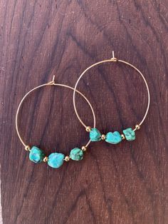 "Handmade 14k gold fill hoop earrings with genuine turquoise beads. Each pair is one of a kind! *DID YOU KNOW* To be considered 'gold filled', the gold layer must be at least 5% of the total metal content, so this means it will last longer than gold plated or vermeil. Gold filled items are perfect if you're looking for a material that is higher quality than gold plated, but an affordable alternative to solid gold.  Hoop Diameter: 1.75\" Wire Gauge: 20" Turquoise 14k Gold Filled Bohemian Earrings, Turquoise Bohemian 14k Gold-filled Earrings, Bohemian Turquoise 14k Gold-filled Earrings, Bohemian Turquoise 14k Gold Filled Earrings, Turquoise Gold Bohemian Earrings, Small Turquoise Hoop Earrings For Everyday, Turquoise Hoop Earrings With Natural Stones, Turquoise 14k Gold Filled Earrings For Everyday, Everyday Turquoise Hoop Earrings