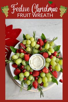 a white plate topped with grapes and strawberries