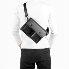 Material: Leather Size: 25*9.5*17.3cm/ 9.8*3.7*6.8 inch Black Belt Bag With Pockets For Business, Black Business Belt Bag With Pockets, Modern Rectangular Belt Bag For On-the-go, Rectangular Belt Bag With Pockets For Business, Classic Rectangular Belt Bag For Business, Classic Rectangular Business Belt Bag, Modern Leather Flap Bag For On-the-go, Modern Chest Shoulder Bag For Travel, Modern Leather Chest Bag For Travel