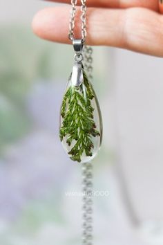 "Delivery of orders is carried out as usual. All orders are being sent using our warehouse in the United States via USPS. Delivery of orders is carried out as usual. All orders are being sent using our warehouse in the United States via USPS. Resin necklace in a teardrop shape with real Juniper leaves. The juniper tree is believed to possess the ability to cleanse and make us pure and true to ourselves. ✿... The pendant measures about 1,6\" tall by 0,7\" wide and about 0,4\" deep ( 40mm x 18mm x Nature-inspired Teardrop Pendant Necklace As Gift, Nature-inspired Teardrop Pendant Necklace For Gifts, Handmade Teardrop Necklace With Nature-inspired Style, Handmade Teardrop Necklace With Nature-inspired Design, Handmade Teardrop Necklace In Nature-inspired Style, Botanical Leaf Shaped Jewelry For Gifts, Botanical Leaf-shaped Jewelry For Gifts, Botanical Leaf-shaped Jewelry Gift, Botanical Leaf Style Jewelry As Gift