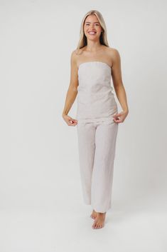 Elevate your outfit instantly with the Myrna Linen Top! This beauty is perfect for dressing up and going out, or styling with a cardigan for more casual days. You'll love its linen breathability and luxury feel. Pair with our Ellen Linen Pants in Khaki for the perfect summer set! FIT: Runs true to size. MATERIAL: 100% Linen. GARMENT DETAILS: Linen tube top with center back zipper. Features a longer length drape, with an A-line flare. SIZE GUIDE: XS (0-2) / S (2-4) / M (6-8) / L (10-12) / XL (14-16) MODEL DETAILS: MISSES Mackenzie - Size S Heather - Size S Bust 34" 34" Waist 27.5" 27.5" Hips 40.5" 37.5" Height 5'7" 5'7" Effortless Linen Tops For Day Out, Versatile Linen Tops For Vacation, Relaxed Linen Tops For Day Out, Beige Linen Tops For Vacation, Feminine Linen Relaxed Fit Tops, Feminine Linen Tops With Relaxed Fit, Feminine Relaxed Fit Linen Tops, Chic Linen Top In Flax Color, Spring Flax Color Tops For Daywear