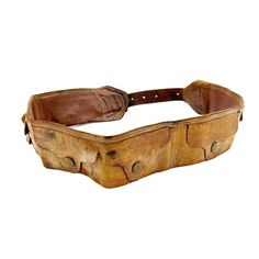 "Fashion meets function with this 1970's 100% leather utility style belt. The belt is made from high qualify brown leather and is beautifully worn from age. It's 2 3/8\" thick with a 6 snapping flap pocket compartments to store small, flat items. It has it's original metal hardware and adjusts in length from 28\" - 38\". A unique, retro addition to your wardrobe! Condition: Good vintage condition, beautifully worn leather. Measurements: Length adjusts from 28\" - 38\" Width 2 3/8\"" Leather Belt Bag With Pockets, Leather Waste Belt, Took Belt, Leather Adventure Belt, Western Belt Bucket, Brown Canvas Belt, Belt Sachel, Brown Leather Belts And Suspenders With Brass Hardware, Brown Belt With Brass Hardware For Everyday