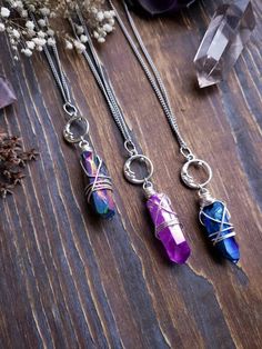 "Witchy moon quartz crystal necklace with your choice of quartz color - AB Peacock, AB Pink, AB Blue. Necklace comes on stainless steel chain suitable for those with allergies. Clasp is high quality 304 stainless steel and measures 8x13mm. ➳ Moon charm is 20mm ➳ Chain length is 18\" - total length is approximately 22\" ➳ All components are lead and nickel free ➳ Please note the size, color and shape of crystal will vary slightly due to natural inconsistencies ̩̩͙✩*̩̩͙*˚＊ ̩̩͙✩*̩̩͙*˚＊ ̩̩͙✩*̩̩͙*˚＊ Magical Wire Wrapped Crystal Necklaces For Gifts, Magical Wire Wrapped Crystal Necklaces As A Gift, Magical Wire Wrapped Crystal Necklace Gift, Spiritual Wire-wrapped Metal Crystal Necklace, Nickel Free Metal Crystal Necklace For Gifts, Nickel-free Metal Crystal Necklace For Gift, Handmade Mystical Metal Crystal Necklaces, Spiritual Metal Crystal Necklaces As Gift, Purple Metal Crystal Necklaces As Gift