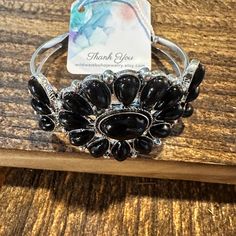 This Handmade Boho Black Gemstone Open Cuff Bangle Bracelet comes with a beautiful gift box and is expertly crafted to add a touch of elegance to any outfit. The black gemstone adds a unique and stylish element, making it a perfect gift for any occasion. One Size Fits All, Ships in Gift box, FAST shipping Black Metal Cuff Bracelet As Gift, Black Metal Cuff Bracelet For Gift, Black Costume Jewelry As A Gift, Elegant Metal Cuff Bracelet With Gemstone, Costume Jewelry Cuff Bangle Bracelet For Gift, Elegant Adjustable Bangle With Stones, Elegant Adjustable Stones Bangle, Adjustable Costume Jewelry Bangle As Gift, Adjustable Costume Jewelry Bangle For Gifts