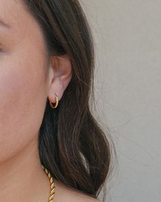 Everybody needs a classic hoop in their collection. This is a mini version of our original Luz hoops! They are perfect for everyday wear and great for styling with other hoops & earrings. Wear these all day, every day but remember to take them off before you shower! THE DETAILS: 18k gold plated high quality sterling silver Can be worn all day long without pain or irritation. Hoop Diameter: 13 mm Hoop Thickness: 1.8 mm Check out our Jewelry Guide to get more info! Trendy Hypoallergenic Hoop Cartilage Earrings, Trendy Single Hoop Cartilage Earring, Everyday Small Hoop Earrings With Ear Wire, Hypoallergenic Hoop Earrings Trendy Style, Everyday Hoop Earrings With Ear Wire, Small Hoop Single Wrap Earring Gift, Trendy Everyday Hoop Cartilage Earrings, Everyday Small Hoop Single Earring, Trendy Everyday Pierced Wrap Earrings