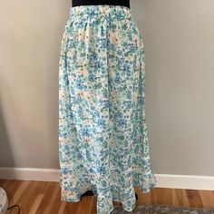 Blue, Green, And Yellow Floral Midi/ Maxi Skirt With Bent Details And Sinchable Stretchy Waist Band. Never Worn, New With Tags. Fits Between A 2-6 Spring Full Maxi Skirt With Elastic Waistband, Spring Vacation Maxi Skirt With Elastic Waistband, Flowy Spring Maxi Skirt With Lining, Spring Maxi Skirt With Elastic Waistband For Daywear, Flowy Lined Maxi Skirt For Spring, Non-stretch Maxi Skirt For Spring Vacation, Non-stretch Tiered Maxi Skirt For Spring, Casual Flowy Skirt With Floral Print, Casual Flowy Floral Print Skirt