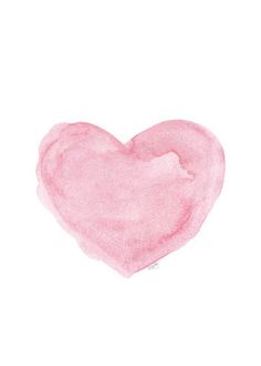 a pink heart painted in watercolor on white paper