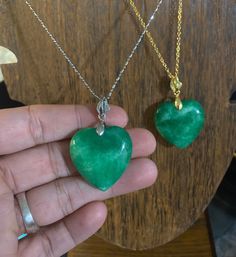 Beautiful polished natural jade stone heart necklaces. In gold colored or stirling silver. Jade is well known stone for good fortune and luck, prosperity. Great hues of greens all throughout the stones. Green Jade Heart Necklace, Green Amulet Jewelry As A Gift, Jade Pendant Jewelry As A Gift, Heart-shaped Emerald Necklaces As A Gift, Heart-shaped Emerald Necklace As A Gift, Heart Shaped Emerald Necklace As A Gift, Heart-shaped Emerald Necklace For Gift, Spiritual Jewelry With Heart Pendant And Natural Stones, Green Gemstone Necklace For Good Luck