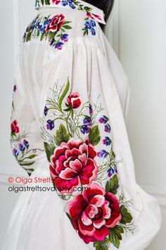 This white embroidered dress has a flared silhouette, floor length, and will be worthy of appearing at any event. A feature of this model is the shirt style of the upper part of the dress hem. this boho dress has a button closure on front and stand-up collar. A long cambric dress with wide sleeves and a flared skirt with a flounce is decorated with incredibly beautiful embroidery which embodies the sophisticated femininity and romantic mood. The bottom of the elegant dress is duplicated with a t White Floral Embroidery Floor-length Dress, White Floor-length Dress With Floral Embroidery, White Floor-length Maxi Dress With Floral Embroidery, White Embroidered Floor-length Dress, White Floor-length Dress With Intricate Embroidery, White Floor-length Embroidered Dress With Intricate Detail, White Floor-length Embroidered Dress, Traditional White Maxi Dress With Floral Embroidery, White Long Sleeve Maxi Dress With Intricate Embroidery