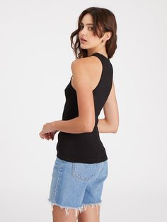 Details Pull-On Halter Neck Sleeveless Ribbed Tank Size + Fit Model is 5'9 wearing size S Front: 23 1/2 inches Back: 24 1/2 inches Fabric + Care Fabric Content: 96% Organic Cotton 4% Spandex Care: Machine Wash Cold, Lay Flat to Dry Import Trendy Black Racerback Halter Top, Trendy Black Sleeveless Tops, Trendy Black Sleeveless Halter Top, Black Racerback Vest For Summer, Black Fitted Seamless Vest, Black Fitted Cami Halter Top, Seamless Sleeveless Halter Top For Night Out, Fitted Black Cami Halter Top, Sleeveless Seamless Halter Top For Night Out