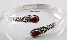 Stunning Red Garnet Gemstone Bangle, 925 Sterling Silver Bangle, Adjustable Bangle, Handmade Silver Bangle, Stylish Bangle, Bangle For Women Welcome in My Shop Description Metal :- 925 Sterling Silver Style :- Bangle ############################################################################################################################################ Benefits Of Garnet Gemstone Benefits of Wearing Garnet Gemstone It protects the wearer from negativity and evil thoughts. It induces passion, fire, energy, stability, and is believed to bring good luck in love and relationships. Garnet is a stone meant to bring success in life and helps to achieve the goals set in life by its possessor. ####################################################################################################### Red Sterling Silver Bangle Cuff Bracelet, Garnet Bangle Jewelry Gift, Garnet Bangle Jewelry As Gift, Adjustable Red Sterling Silver Cuff Bracelet, Handmade Red Sterling Silver Cuff Bracelet, Handmade Silver Garnet Bracelets, Handmade Ruby Bangle Bracelet, Elegant Red Round Cuff Bracelet, Red Sterling Silver Anniversary Bracelet