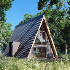 a - frame house in the middle of a field with grass and trees around it