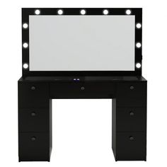 a black vanity with lights on it and a mirror over the top that is lit up