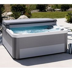 a hot tub sitting on top of a patio