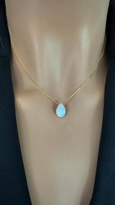 Elevate your style with our breathtaking Teardrop Opal Necklace, a stunning piece that beautifully showcases the iridescent charm of the October birthstone. Perfect for layering or as a minimalist statement, this delicate opal teardrop pendant captures light with every movement, inviting you to embrace its enchanting glow--add it to your collection today and celebrate the magic of opal! Pendant: Lab Opal 8x12mm Chain: 925 Sterling Silver Box Chain, Gold Plated or Rose Gold Plated chain over ster Elegant Faceted Pear-shaped Necklace, Teardrop Birthstone Necklace For Anniversary, Anniversary Teardrop Gemstone Drop Necklace, Elegant Pear-shaped Faceted Necklace, Elegant Briolette Faceted Drop Necklace, Elegant Briolette Drop Necklace With Faceted Detail, Gemstone Drop Necklace For Anniversary, Elegant Faceted Drop Necklaces, Dainty Briolette Gemstone Drop Necklace