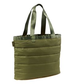 Super light, super fun-our reversible puffer tote is quilted on one side and smooth on the other to give you double the options. Makes a great gift! Side with pocket is made of nylon twill. Quilted side is made of recycled polyester. Spot clean. Rugged webbed handles are the perfect length for carrying by hand or over shoulder. Roomy main compartment. Inside pocket. Puffer-style baffle design for great texture and a cozy feel. Lightweight and reversible, in contrast colors (except Black). Import Casual Nylon Puffer Bag, Versatile Quilted Bag For Outdoor, Casual Insulated Nylon Bags, Outdoor Nylon Quilted Bags, Puffer Style, Black Puffer, Travel Tote, Bags Travel, Everyday Bag