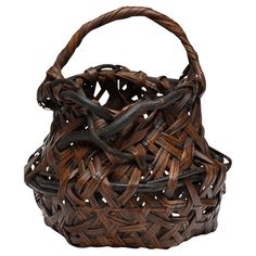 a brown woven basket on a white background